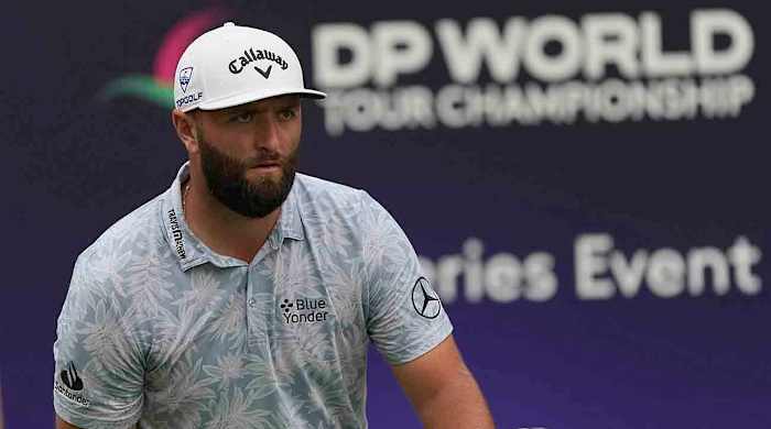 Jon Rahm follows his ball during the 2023 DP World Tour Championship in Dubai, United Arab Emirates.